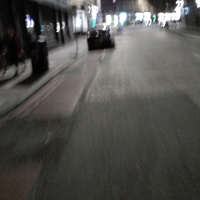 A photo of a bike lane with a car in it